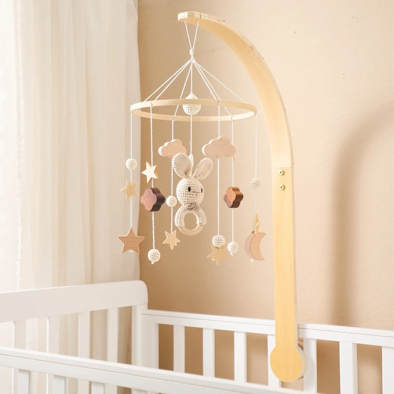 Wooden mobile – with bunnies and playful figures – for a crib or dresser
