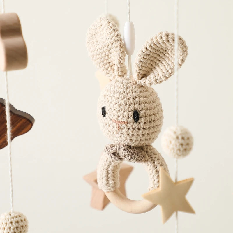 Wooden mobile – with bunnies and playful figures – for a crib or dresser